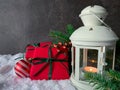 Christmas and New Year background. Gift boxes, decorations and candle lamp. Royalty Free Stock Photo