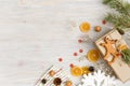 Christmas or New Year background with gingerbread deer cookie, nuts, fir tree branch, garlands, dried oranges, cones and Royalty Free Stock Photo