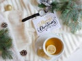 Christmas and New Year background with greeting hand lettering note and tea cup