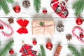 Christmas or New Year background made of fir branches, decorations, berries, candy, gift boxes and pine cones Royalty Free Stock Photo
