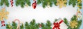 Christmas and New Year background with realistic pine branches, candy canes, serpentine, gifts box, glitter gold snowflake.