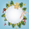 Christmas and New Year background with realistic pine branches, shining garlands, candy canes, serpentine, glitter gold snowflake