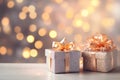 Christmas and new year background. Shiny gift boxes near decorated christmas tree over blurred white wall with lights, copy space Royalty Free Stock Photo