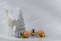 Christmas or New Year background with silver snowy tree and golden transitional decoration, deer Royalty Free Stock Photo
