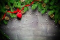 Christmas and New Year background. Christmas tree branch on a black background. Cones and fur-tree toys. View from above. Royalty Free Stock Photo