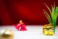 Christmas and New Year background. Xmas pine fir lush tree. Santa clause golden gifts box. Glass Balls. Royalty Free Stock Photo