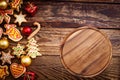 Christmas, New Year Background. Xmas wooden table with cookies and cutting board for food and pizza. Top view, copy space, mockup