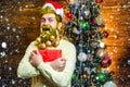 Christmas or New Year barbershop concept. Beard with bauble. Santa in barber shop. Christmas style for modern Santa. Royalty Free Stock Photo