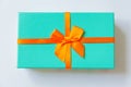 Christmas New Year birthday valentine celebration present romantic concept. Simply minimal design blue gift box with orange ribbon Royalty Free Stock Photo