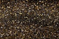 Christmas New Year Black and Gold Glitter background. Holiday abstract texture fabric Royalty Free Stock Photo