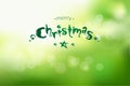 Christmas and New Year bokeh green background with scribble lettering Royalty Free Stock Photo