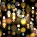 Christmas and New Year bokeh light holiday background. Abstract gold bokeh light on black color background. Royalty Free Stock Photo