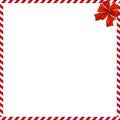 Christmas or new year border with red and white lollipop pattern wrapped with red festive ribbon.