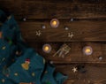 Christmas and New Year with candles, golden stars and green textile decoration, dark background