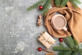 Christmas or New Year composition. Decorations, fir and spruce branches, cup of coffee, on a gray concrete background. Top view, Royalty Free Stock Photo