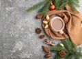 Christmas or New Year composition. Decorations, cones, fir and spruce branches, cup of coffee, on a gray concrete background. Top Royalty Free Stock Photo