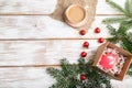 Christmas or New Year composition. Decorations, red balls, fir and spruce branches, on a white wooden background. Top view, copy Royalty Free Stock Photo