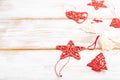 Christmas or New Year composition. Decorations, red stars, bells, on a white wooden background. Side view, copy space, selective Royalty Free Stock Photo