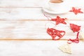 Christmas or New Year composition. Decorations, red stars, bells, on a white wooden background. Side view, copy space, selective Royalty Free Stock Photo