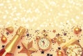 Christmas or New Year composition, frame, pink background with gold Christmas decorations, stars, snowflakes, balls, alarm clock, Royalty Free Stock Photo