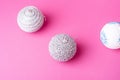 Christmas New Year composition. Gifts, silver and white ball decorations on pink background. Winter holidays concept Royalty Free Stock Photo