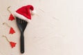 Christmas and new year composition with kitchen tools and Santa hat on grey conctere background. Xmas cooking concept. Top view Royalty Free Stock Photo