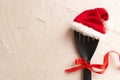 Christmas and new year composition with kitchen tools and Santa hat on grey conctere background. Xmas cooking concept. Top view Royalty Free Stock Photo