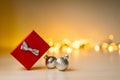 Christmas and New Year composition. Red gift box with gold gold boke lights, christmas decorations