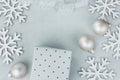 Christmas New Year Composition Snow Flakes Baubles Gift Box White Silver Curled Ribbon on Gray Stone Background. Greeting Card Royalty Free Stock Photo