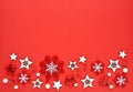 Christmas or new year composition. Snowflakes and decorative stars on red background. Holiday and celebration concept for postcard Royalty Free Stock Photo