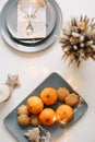 Christmas and New Year composition. tangerines, ginger cookies. festive table setting. Flat lay, holiday background.