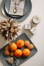 Christmas and New Year composition. tangerines, ginger cookies. festive table setting. Flat lay, holiday background.