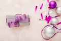 Christmas or New Year composition. Xmas purple and silver decorations: ribbons and balls on pink pastel background. Flat lay, top Royalty Free Stock Photo