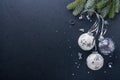 Christmas or New Year concept with black and silver baubles ball, gift box and champagne with decorated silver metallic ribbon on Royalty Free Stock Photo