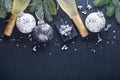 Christmas or New Year concept with black and silver baubles ball, gift box and champagne with decorated silver metallic ribbon on Royalty Free Stock Photo