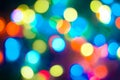 Defocused abstract multicolored bokeh lights background. Blue, purple, green, orange colors. - christmas and new year concept Royalty Free Stock Photo