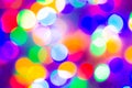 Defocused abstract multicolored bokeh lights background. Blue, purple, green, orange colors. - christmas and new year concept Royalty Free Stock Photo