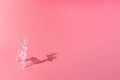 Christmas and New year 2022 concept. Diamond sparkling deer on pale rose background. Minimal copy space concept Royalty Free Stock Photo