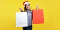 Christmas and new year concept. Portrait of satisfied buyer, brunette woman with charming smile in casual checkered shirt. indoor