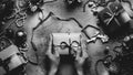 Christmas New Year concept top view. Unrecognizable Woman Wrapping Draws a Gift Box On Wooden Table, Point Of View Black And White Royalty Free Stock Photo