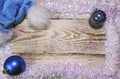 Christmas and New Year Concept. wooden board in a frame of brilliant artificial snow and and hat of Santa Claus, Top view, flat la Royalty Free Stock Photo