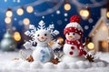 Christmas and new year with couple snowman doll, golden star with pine tree on white snow season in blue bokeh light background