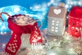 Christmas and New Year cozy holiday composition with cinnamon, scarf, pine cone, mugs with cocoa or chocolate