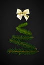 Christmas and New Year dark background with minimal christmas tree