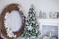 Christmas and New Year decorated white interior room with presents and New year tree and fireplace Royalty Free Stock Photo