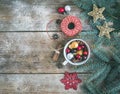 Christmas (New Year) decoration background: a cup full of colorful Christmas tree toys, cinnamon sticks, glittering toy stars and Royalty Free Stock Photo