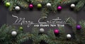 Christmas or New Year decoration background: fir-tree branches, colorful glass balls on black Royalty Free Stock Photo