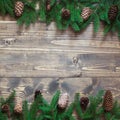 Christmas decoration background. Fir tree branches on wooden background with copy space. Top view and flat lay. Royalty Free Stock Photo