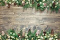 Christmas decoration composition of fir tree branches on wooden background with copy space. Top view. Royalty Free Stock Photo