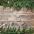 Christmas or New Year decoration background. Fir tree branches on wooden background with copy space. Pattern. Royalty Free Stock Photo